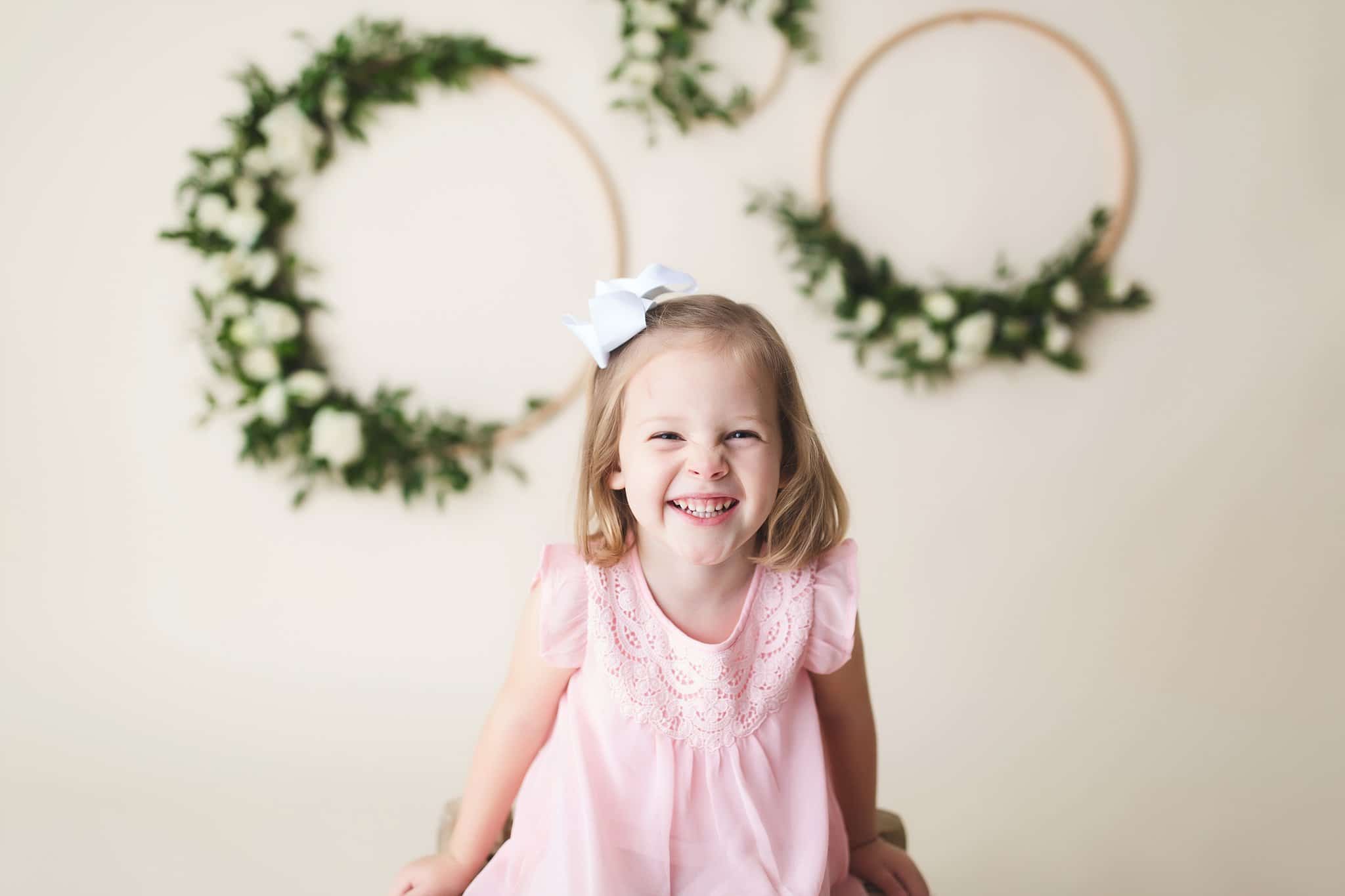 little girl cream background floral wreaths 1st Birthday Pics Jacksonville