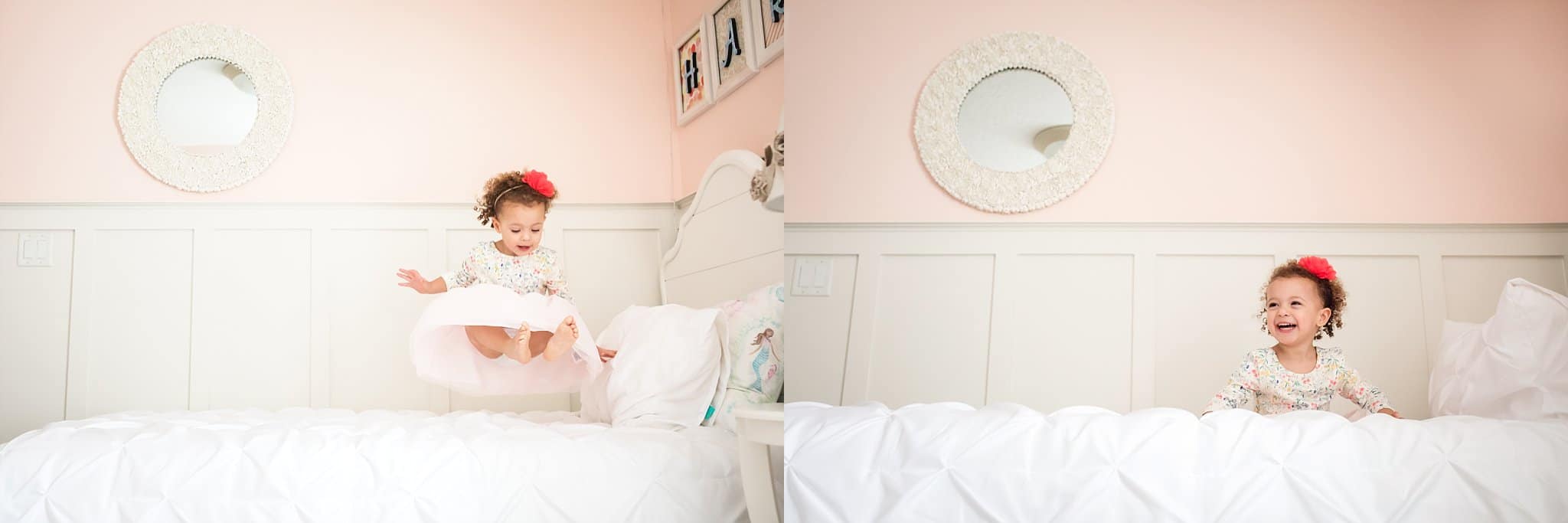 St Augustine Lifestyle Photographer little girl jumping on white bed surrounded by blush walls