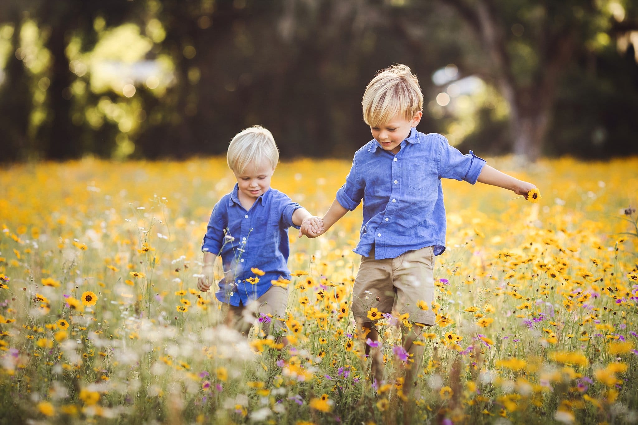 NE FL Family Photography brothers running through yellow flower field