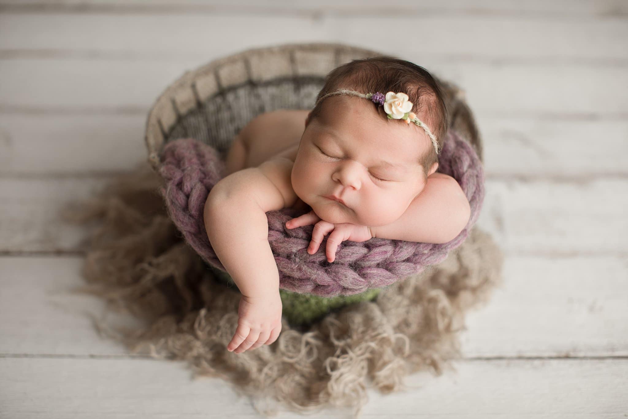 chubby cheek baby girl sleepin natural basket purple knit blanket New Baby Photos In Jacksonville