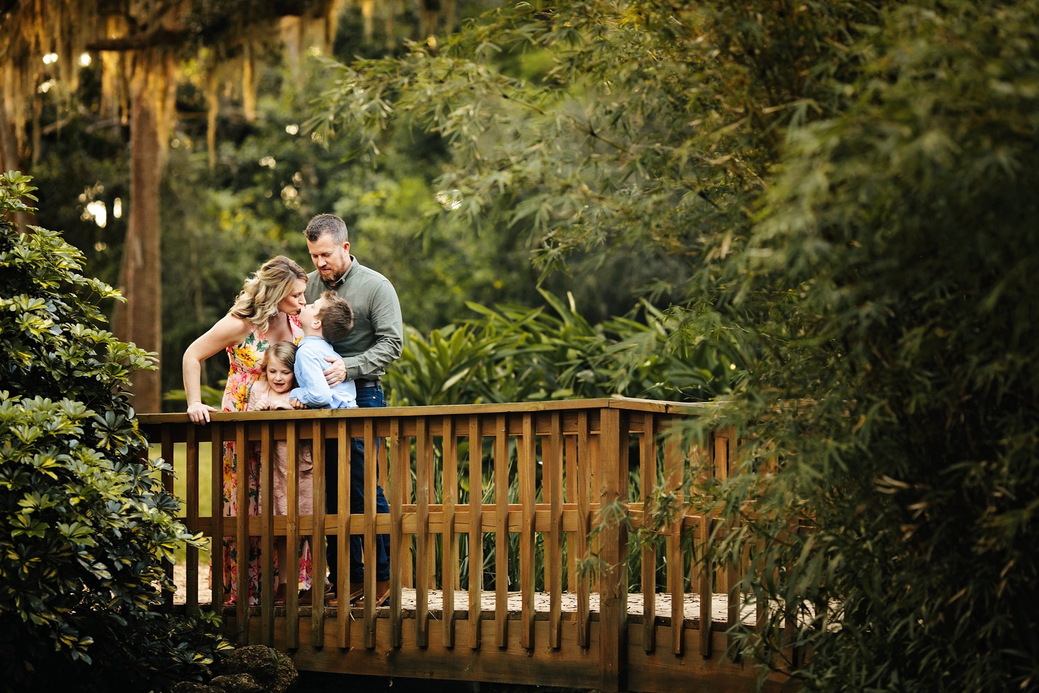 St Augustine Maternity Photographer Washington Oaks Gardens State Park family of 4 standing on small bridge