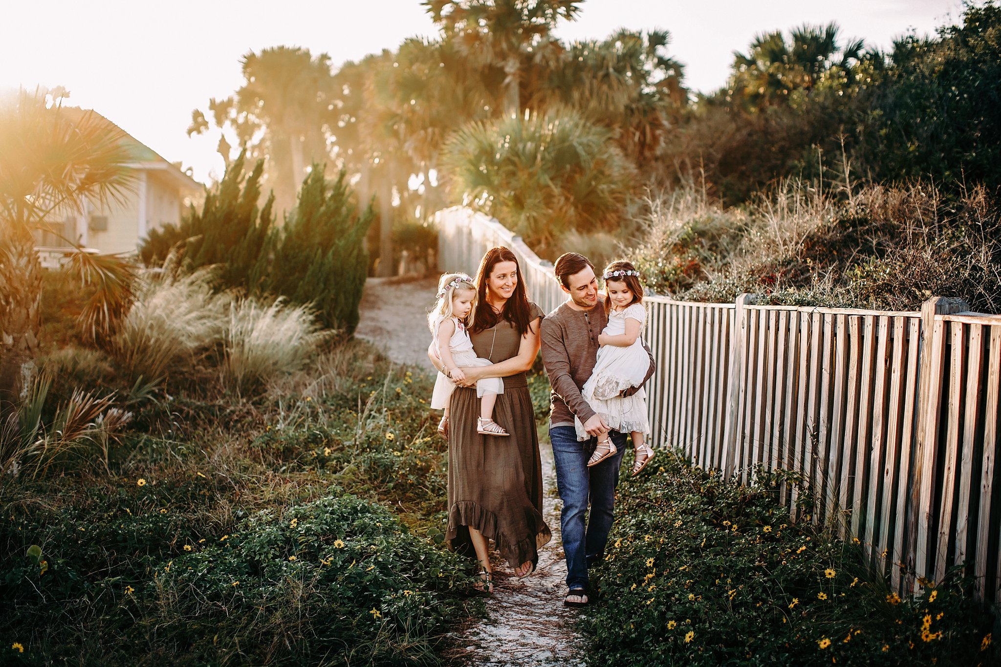 Beach Photos in Ponte Vedra family of 4 walking a path in the dunes