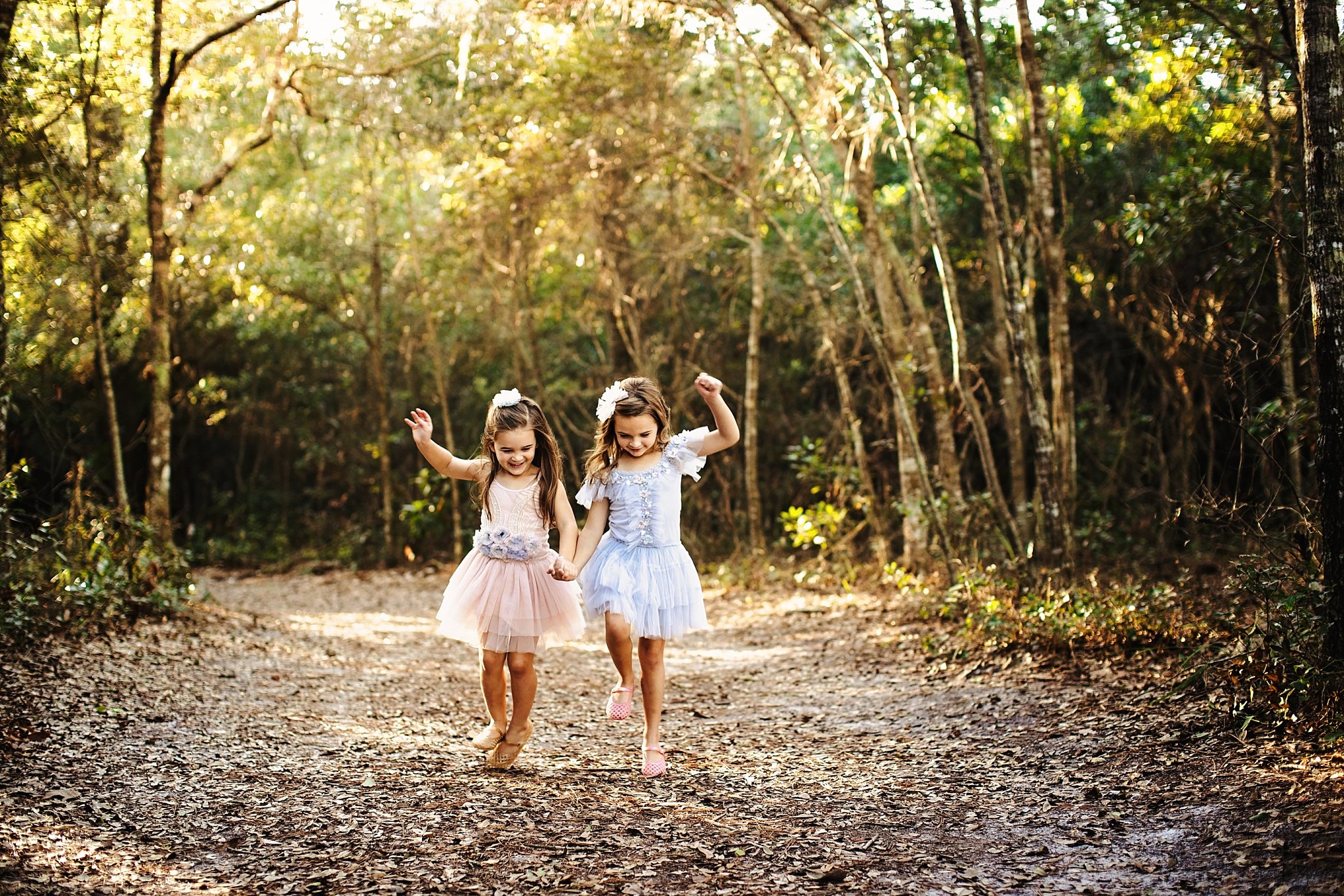 two little girls skipping together 