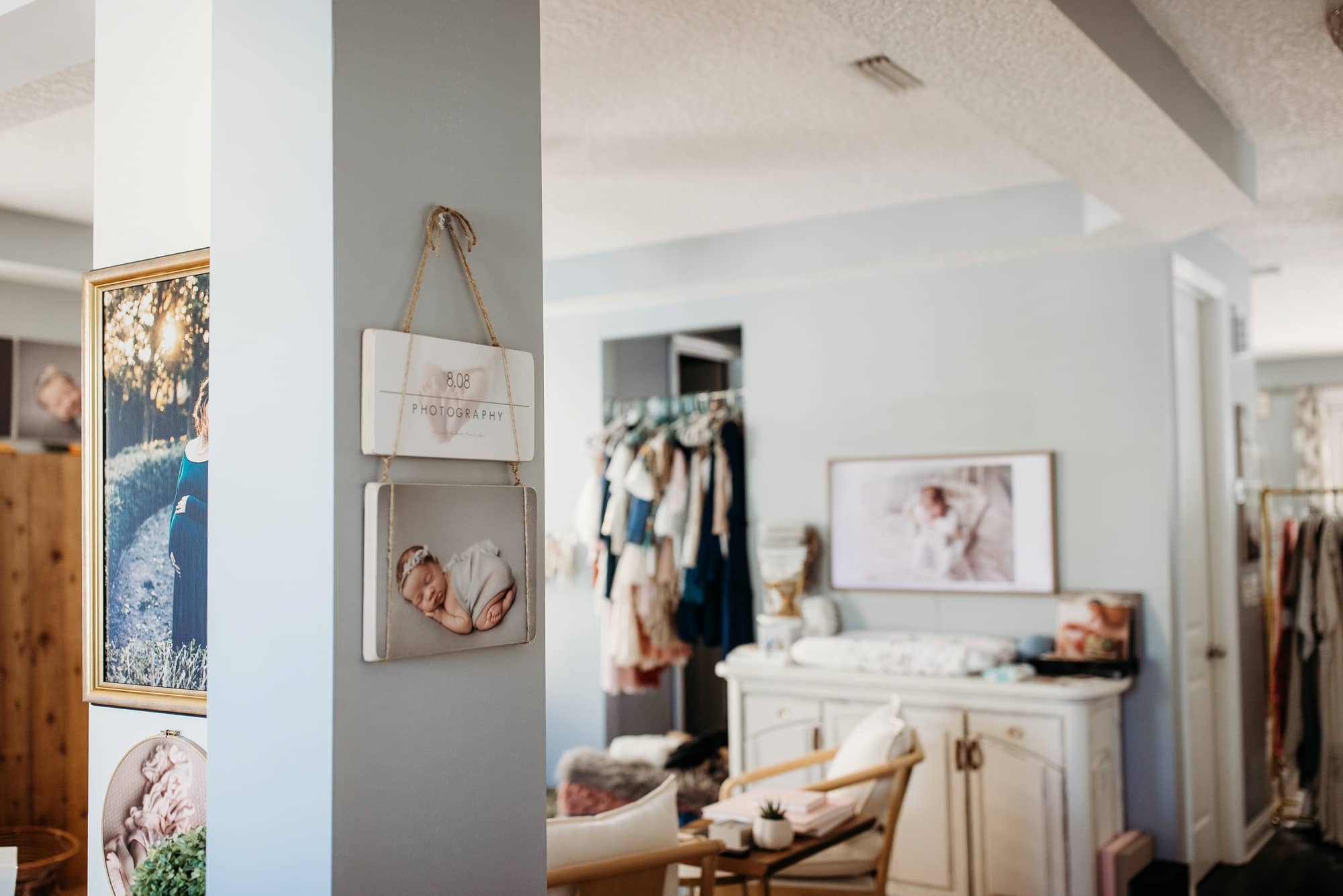 walking through front door of 8.08 Photography Newborn Studio in Ponte Vedra Fl
